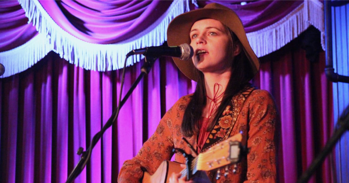 amy goloby performing SXSW red curtains sunflower shirt hat